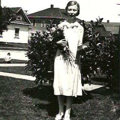 Mary with roses for her graduation.jpeg